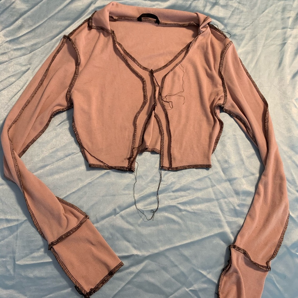 Pink long sleeve crop top with black detail